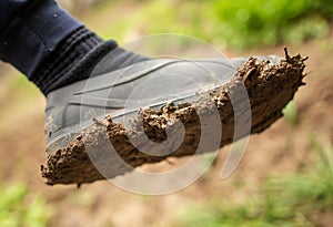 Dirt on a galosh on foot