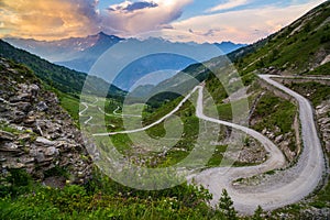 Dirt mountain road leading to high mountain pass