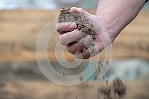 Dirt pouring through hand