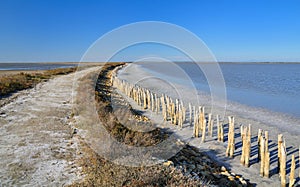 Dirt road in an abandoned salt evaporation pond