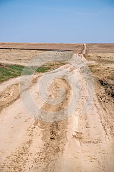 Dirt road with deep vehicle tracks