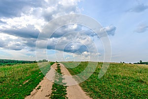 Dirt road in a field