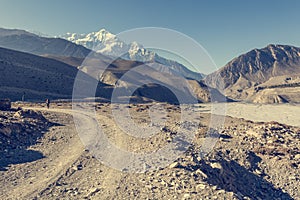 Dirt road following river bed.