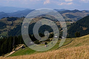 Dirt road high in the mountains that goes down to the village in the valley