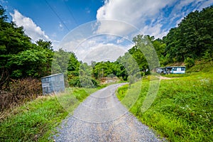 Dirt road and house in the rural Shenandoah Valley, Virginia.