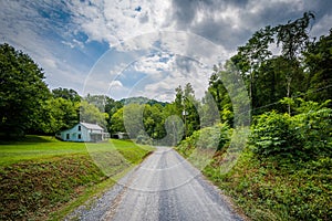 Dirt road and house in the rural Shenandoah Valley, Virginia.