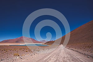 Dirt road leading to the Siloli salt flats photo