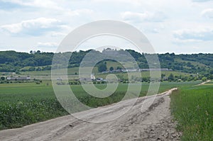 The dirt road leads to the old castle