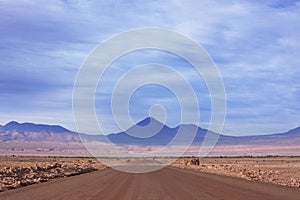 A dirt road leads to the Volcano Licancabur in San