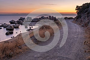 Dirt road over the Aegean Sea during sunrise