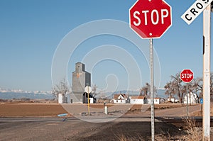 Dirt road with a railroad crossing controled with stop signs