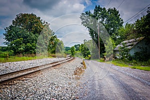 Dirt road and railroad track in rural Carroll County, Maryland.