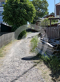 dirt road in the small town during the summer photo