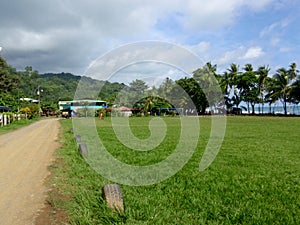 Dirt road and Soccer field of Beach town of Punta Banco photo