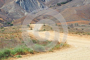 Dirt road in the stone desert. Open road