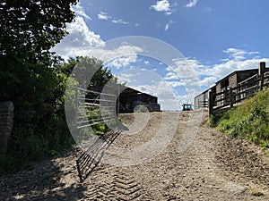 Dirt track, leading to farm buildings near, Otley, Yorkshire, UK