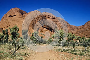 Dirt track leading towards rock formation