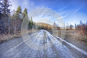Dirt, Unpaved Road Covered In Ice