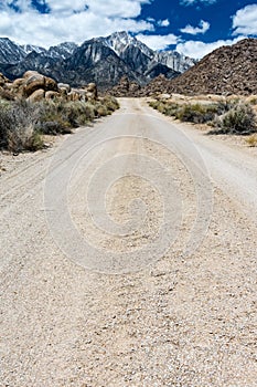 Dirt unpaved road leading through the Alabama Hills in Lone Pine California