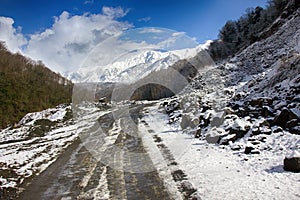 Dirt winter road from Black sea coast to Main Caucasus range