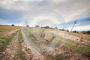 Dirtpath at the top and summit of Vrh Rajac mountain at dusk in autumn. Rajac is a mountain of Sumadija in Serbia, part of the