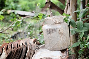 Dirty and abandoned jar in unknown place