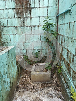 Dirty and abandoned squat toilet