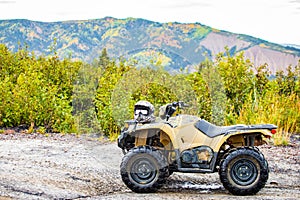 Dirty ATV with scenic background perfect for off road adventures