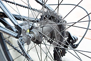 Dirty back hub with cogset gear and wheel bicycle close up