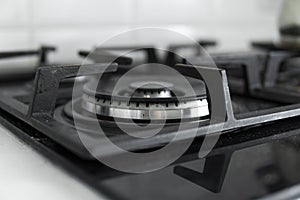 Dirty black glass kitchen stove in home kitchen.