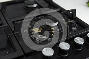 Dirty black glass kitchen stove in home kitchen.