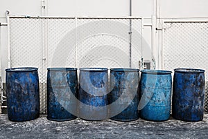 Dirty blue plastic garbage containers