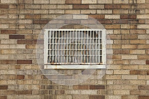 Dirty brick wall with vent