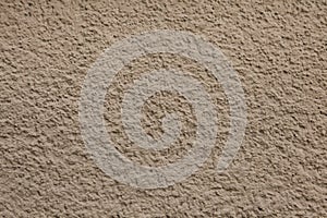 Dirty brown painted stucco wall. Background texture