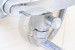 Dirty calcified shower mixer tap, faucet with limescale on it, close up