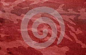Dirty camouflage cloth with blur effect in red tone