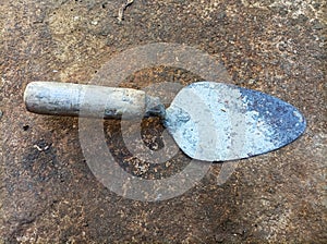 Dirty cement spoon with hardened cement residue