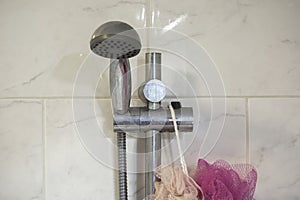 Dirty chrome shower rod with limescale that should be cleaned