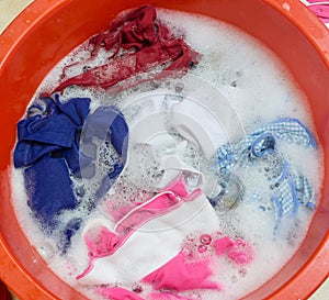 Dirty clothes soak in tub photo