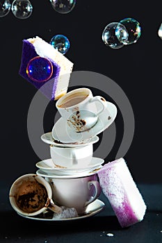 Dirty coffee cups and dish sponges