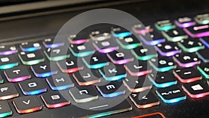 Dirty colourful PC gaming keyboard handheld camera close-up