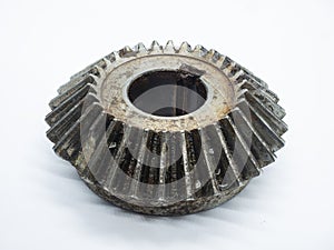 dirty Conical gear with a broken tooth due to wear and tear