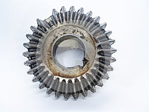 dirty Conical gear with a broken tooth due to wear and tear