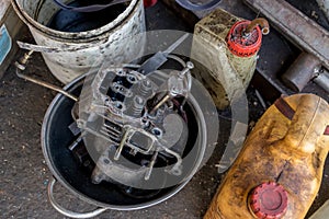 Dirty Diesel Engine in Aluminum Pan with Oil Bottles - Recycling - Vintage Garage