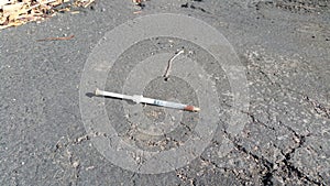 Dirty discarded needle