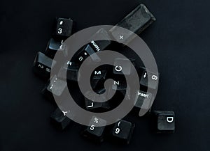 dirty and dusty  black computer keyboard keys on a black background