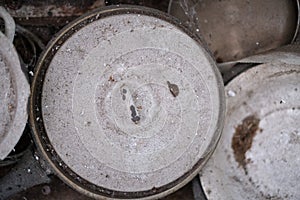 Dirty, dusty, cobwebbed, old kitchen utensils in an abandoned apartment close-up