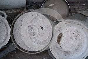 Dirty, dusty, cobwebbed, old kitchen utensils in an abandoned apartment close-up