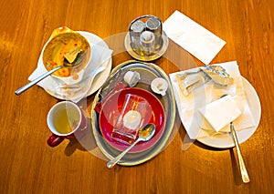 Dirty and empty breakfast dishes photo