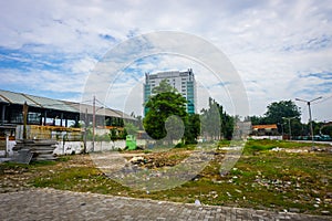 Dirty empty park with trash and cloudy sky as background photo taken in Tanah Abang Jakarta Indonesia